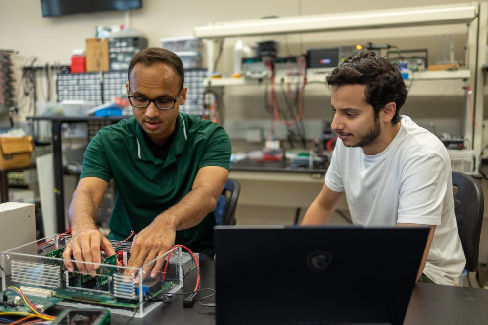 students in lab with equipment