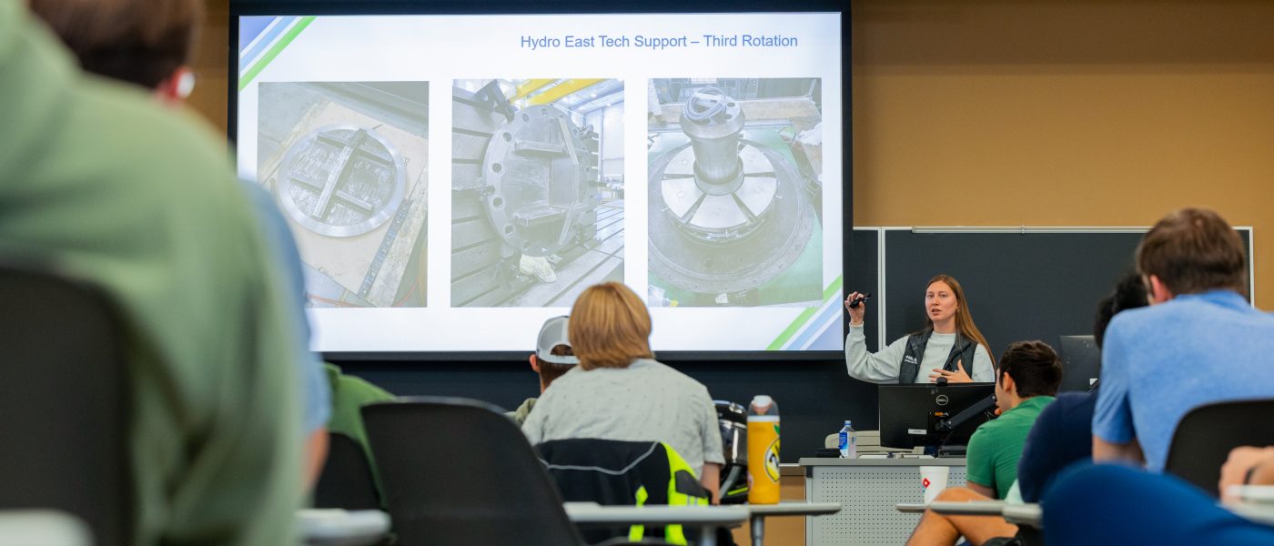 Students attend a Lunch & Learn presentation led by a Duke Energy representative.